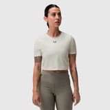 W019 Lycra Cropped Tee in ivory cream worn by model with taupe leggings, front view