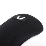 Black knee sleeves detail closeup showing fabric texture and logo patch