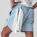 Tetra-Lite 7" Linerless Short in Light Sky, worn with towel over shoulder