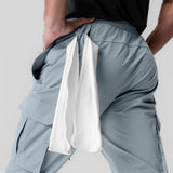Tetra-Lite Ice Cargo High Rib Jogger in light sky, model holding white towel at waist