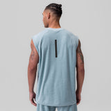 Towel Terry Cutoff sleeveless tank in light sky, back view on model