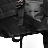 Water Resistant Modular Backpack 16L in black, worn with water droplets visible, detail view