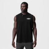 Black Tech Essential Relaxed Cutoff tank top on model, front view