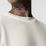 Tech Essential Relaxed Tee in faded stone worn by model, upper body front view