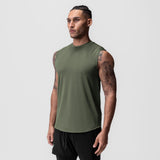 AeroSilver® Cutoff Tank in olive green, worn by model standing against grey background