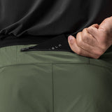 Aerotex Hybrid Liner Short in olive and black, model detail shot of waistband and zipper