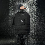 0275 Modular Everyday Pack in black, worn by person in rain