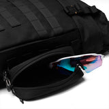 Flatlay of 0275 Modular Everyday Pack in black with sunglasses, open compartment view