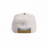 flatlay New Era 9Forty A-Frame Hat in stone with tan suede snapback, back view