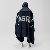 Sherpa Recovery Blanket in navy with white ASRV logo, worn as a cape by model from behind