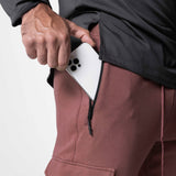 Tech-Terry Cargo High Rib Jogger in Red Earth, worn with white phone in pocket