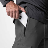 Tech-Terry Cargo High Rib Jogger in Space Grey, model holding white phone in cargo pocket