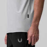 Tetra-Lite Ice Zip Tee in slate grey worn by model, side detail view