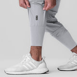 Tetra-Lite Ice Cargo High Rib Jogger in Slate Grey, worn with white sneakers, front view