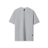 flatlay Tetra-Lite Ice Zip Tee in Slate Grey, front view