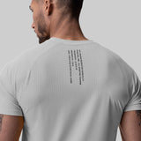 Laser-Vent Established Tee in slate grey worn by model, back view showing perforated fabric