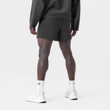 Waffle Knit Sweat Short in space grey, worn by model with white socks, back view