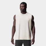 Tech Essential Relaxed Cutoff sleeveless tank in stone white, worn by model, front view