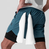Tetra-Lite 5" Liner Short in Storm/Black, model holding shorts to show internal liner