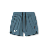 Flatlay of Tetra-Lite 7" Linerless Shorts in storm blue with white wings logo, front view