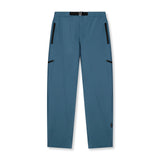 Flatlay of Tetra-Lite Field Pant in storm blue with zip pockets and belt detail