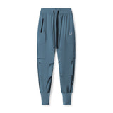 flatlay Tetra-Lite Ice Cargo High Rib Jogger in storm blue, front view