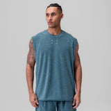 Towel Terry Cutoff sleeveless tank in storm blue, worn by model, front view