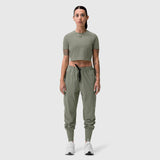 Sage green cropped tee worn with matching cargo joggers, front view on model