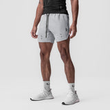 Tetra-Lite 7" Linerless Short in slate grey, worn by model standing in profile