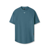 flatlay Laser-Vent Established Tee in storm blue, front view