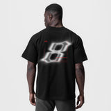 Black Tech Essential Relaxed Tee with blurred graphic design, back view on model