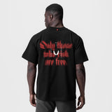 Black Tech Essential Relaxed Tee with red graphic print, back view on model