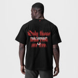 Black Tech Essential Relaxed Tee with red 'Risk Protocol' back print, worn by model, back view
