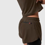 Tetra-Lite Liner Short in Dark Earth worn by model, back view showing rear pocket detail