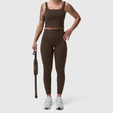 W030 LYCRA® 3-in-1 Legging in Dark Earth, worn by model holding jump rope