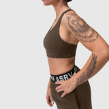 W039 Lycra Hybrid Sports Bra in dark earth, worn by model in side profile pose