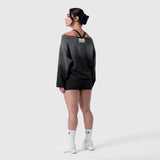 Raw Hem Oversized Crewneck in black sun fade, worn by model standing in profile view