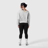Raw Hem Oversized Crewneck in heather grey worn with black leggings, back view