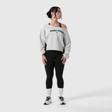 Raw Hem Oversized Crewneck in heather grey worn with black leggings and white socks, front view