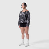Raw Hem Oversized Crewneck in pixel camo worn with black shorts and white sneakers
