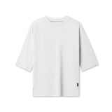 Flatlay of white Supima® 3/4-sleeve oversized tee on white background, front view