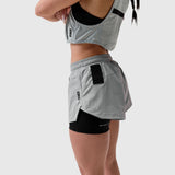 W025 Tetra-Lite Liner Short in slate grey worn with matching sports bra, side view