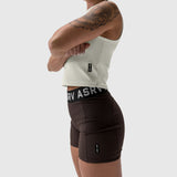 Lycra ribbed mockneck tank in ivory cream worn with black shorts, side view