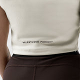 RELENTLESS PURSUIT Lycra Ribbed Mockneck Tank in ivory cream, worn on model