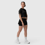 Black AeroSilver® cropped tee worn with black shorts and white sneakers, side view
