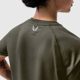 AeroSilver® Cropped Tee in olive, worn by model from back view showing feather logo