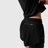 Tetra-Lite® Liner Short in black worn by model, back view showing pocket detail