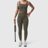 W030 LYCRA® 3-in-1 Legging in olive, worn with matching crop tank top and white sneakers