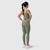 W022 Lycra 2-in-1 tank top in sage, worn by model from behind