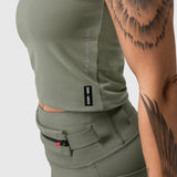 W022 Lycra 2-in-1 tank top in sage worn by model, side view showing fitted silhouette
